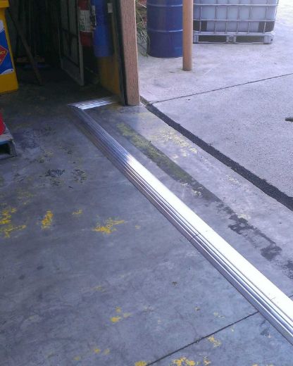 Picture of SPILMAX ALUMINIUM FLOOR BUNDING (1,200MML X 184MMW X 30MMH) PREDRILLED WITH 4 SCREW ANCHORS (10MM X 75MM)